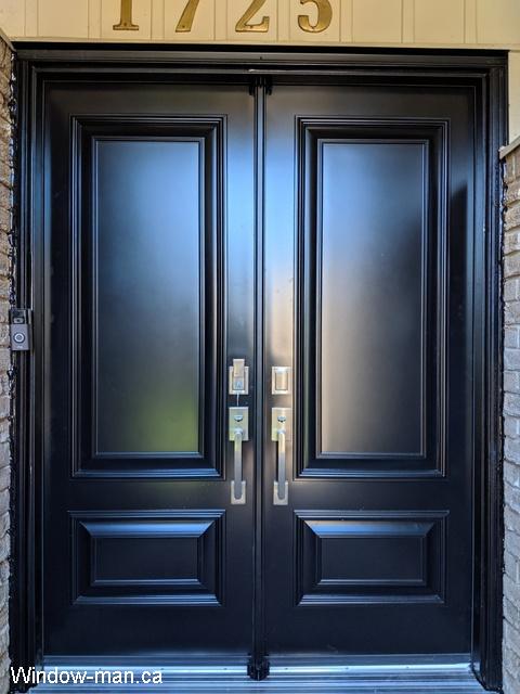 Double narrow steel insulated front entry exterior doors. Raised Executive panels. Each door is 28 inches. Black custom really sharp.